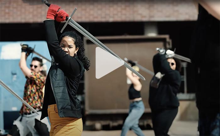 People dueling with swords
