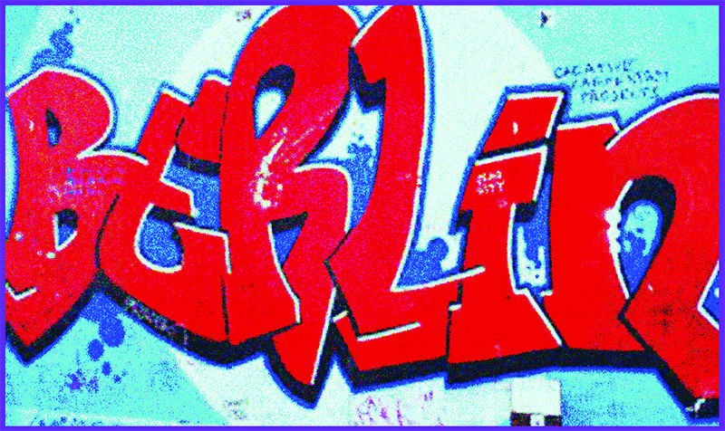 Grafitti art of bold block letters read BERLin in bright red and blue