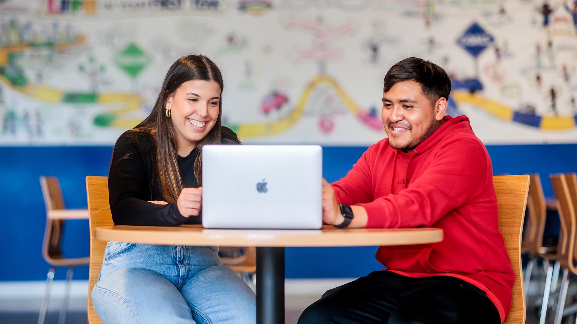 MSU Denver student Maria Dos Santos Oliveira helps Alejandro Reyes complete his class schedule and finalize his transfer to MSU Denver.