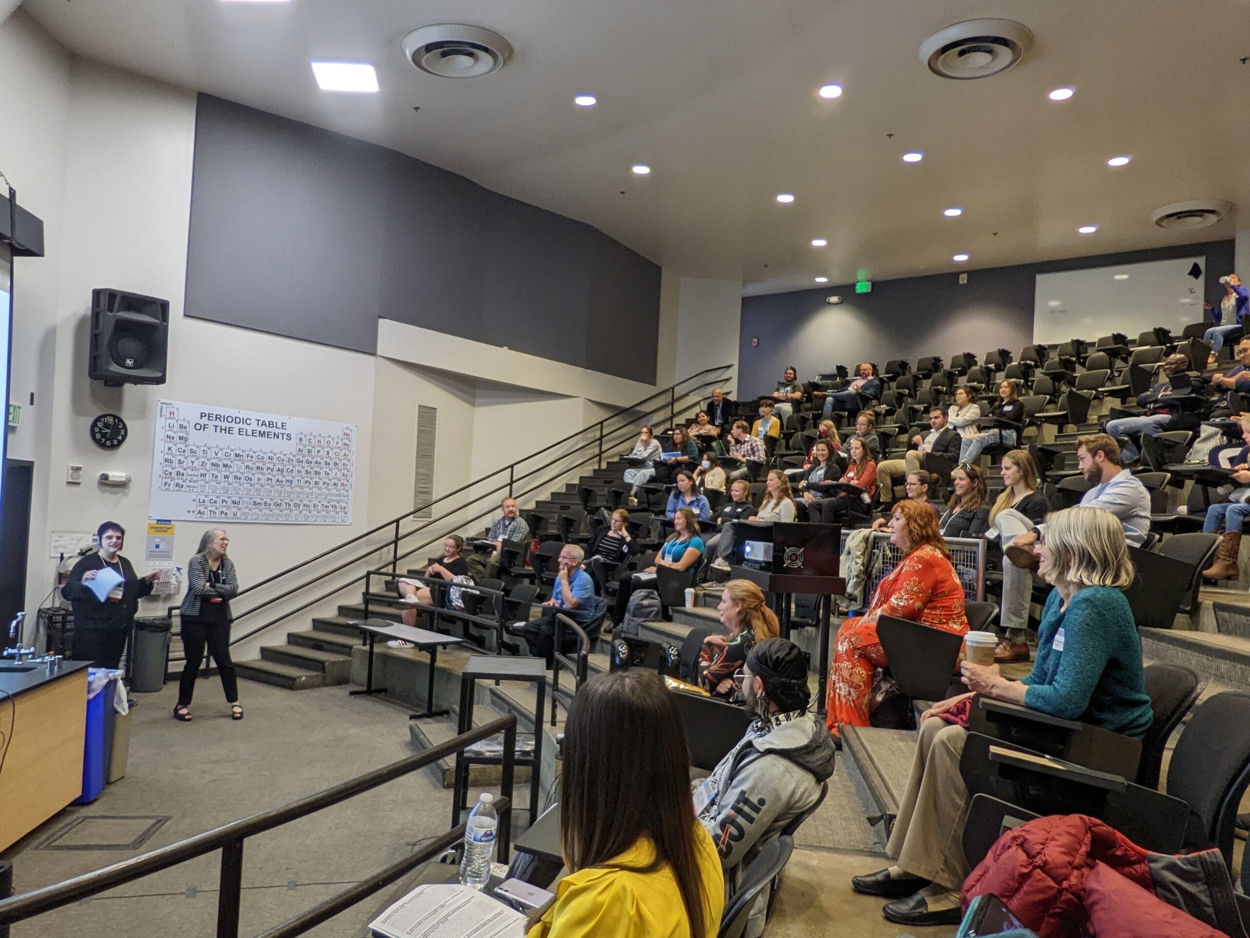 Image of a large stadium classroom with an instructor at the front