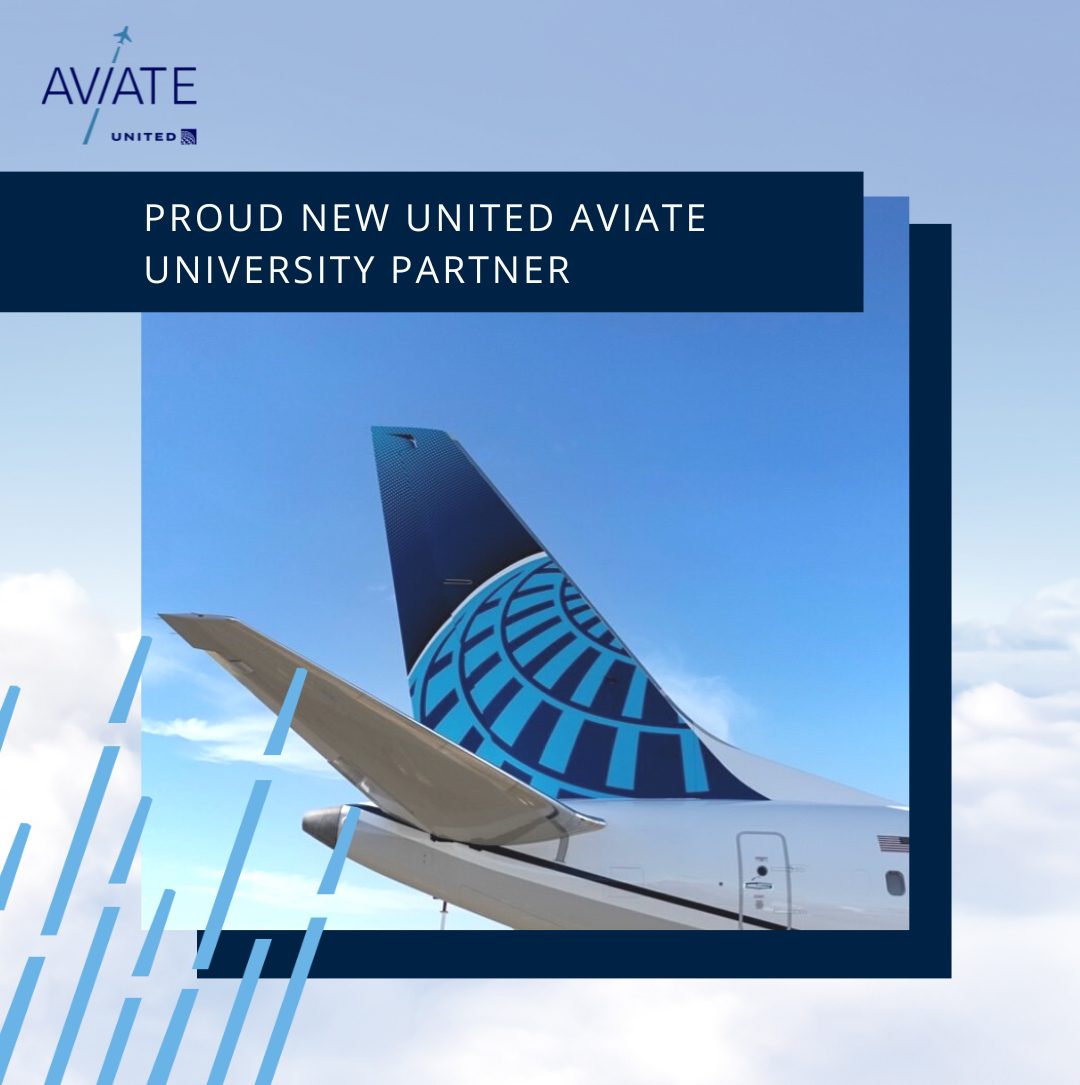 The tail of a Boeing aircraft in front of a clear, blue sky.