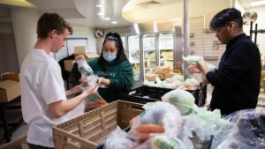 Students filling bags of vegetables at Rowdy's Corner.