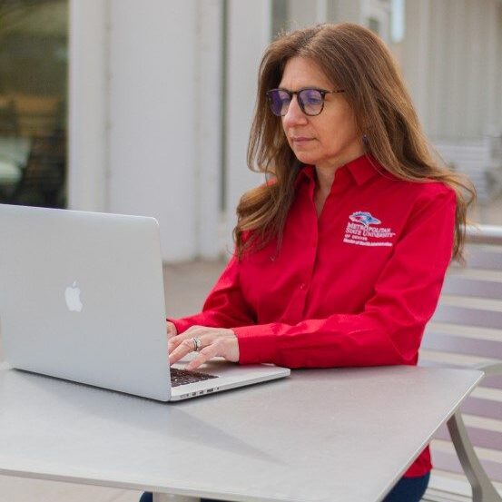 MSU Denver student studying online outside the classroom