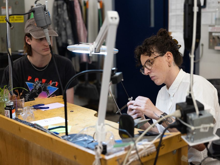 Students and Professor Boyd work in the Jewelry Studio.