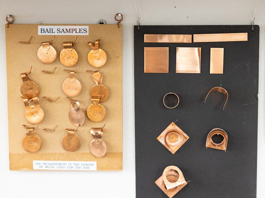 Jewelry Studio examples hanging on the wall.