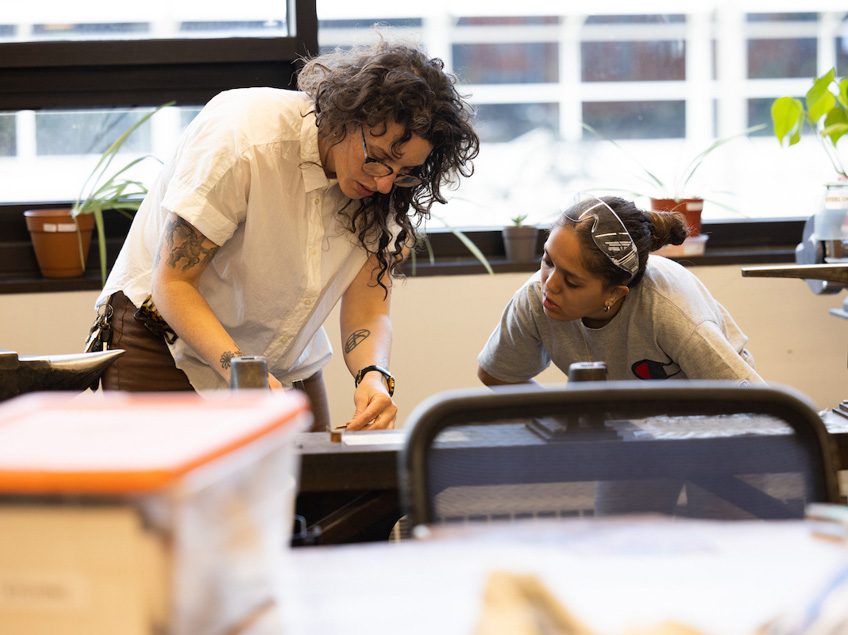 Students and Professor Boyd work in the Jewelry Studio.