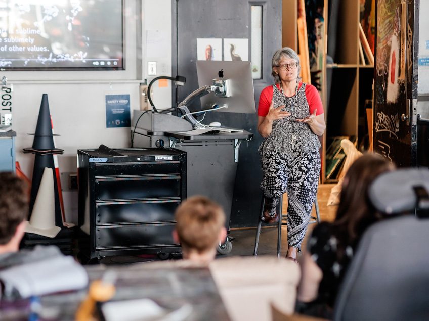 MSU Denver professor, Anne Thulson, speaks to her Painting and New Contexts class on May 3, 2023. Photo by Alyson McClaran
