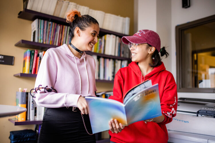 Two students reading MetroSphere