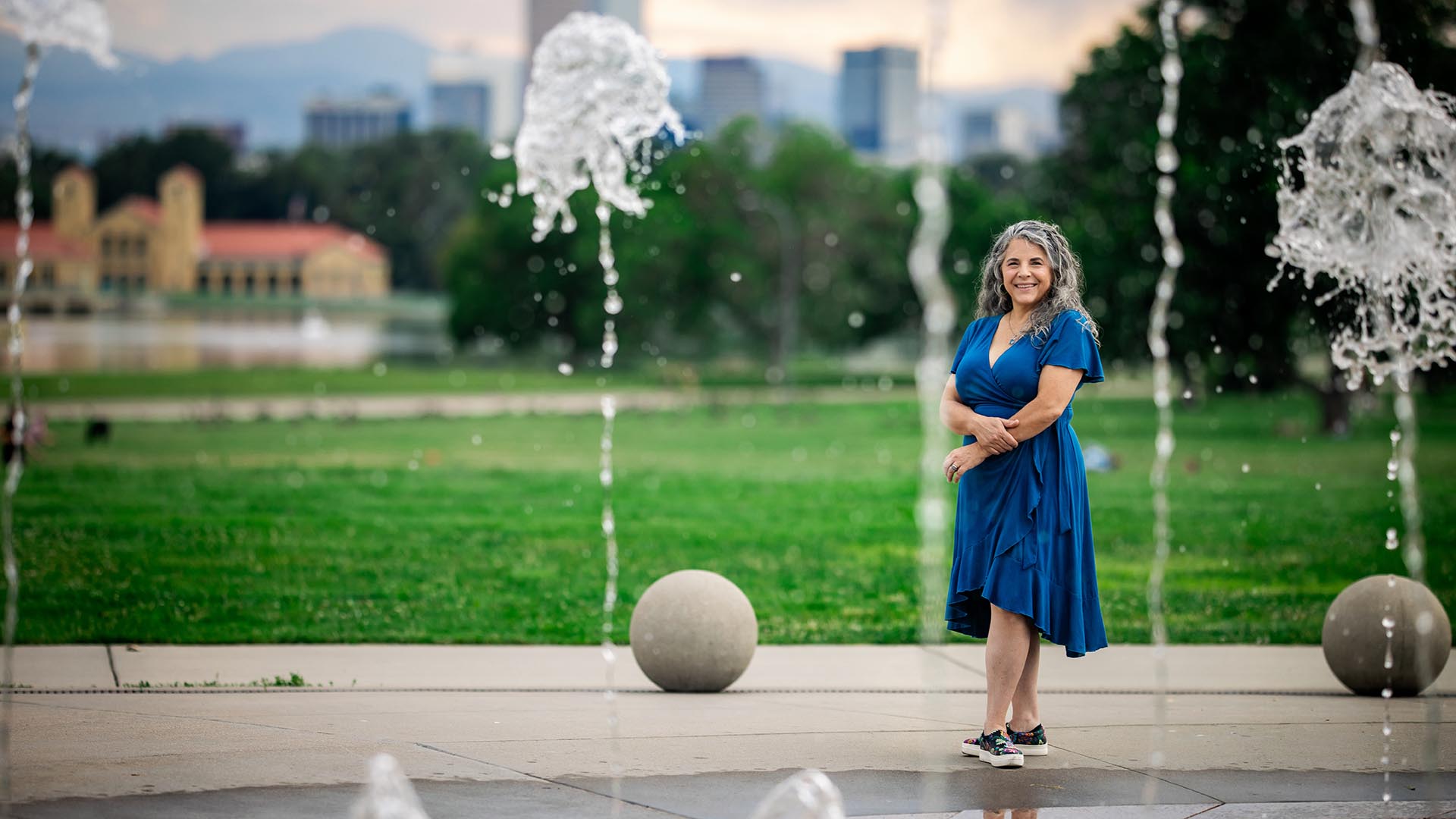 Water student standing at City Park fountain