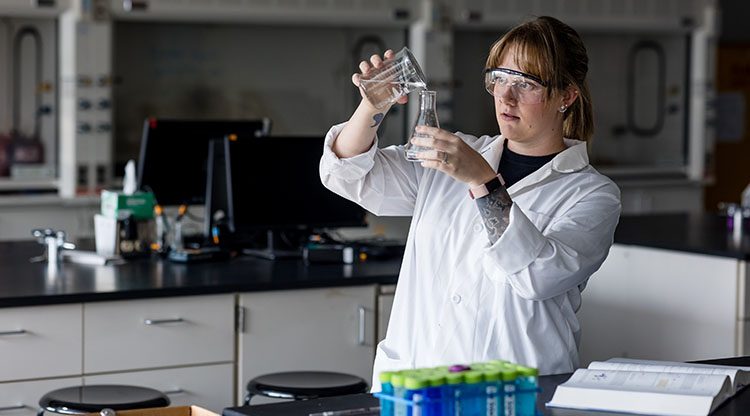 Student in a chemistry lab doing an experiment