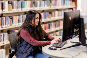 student works on a computer