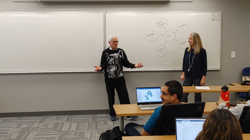 Lynn Hoffman giving instruction in front of a class