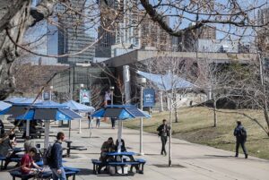 Students walking across campus in late fall.