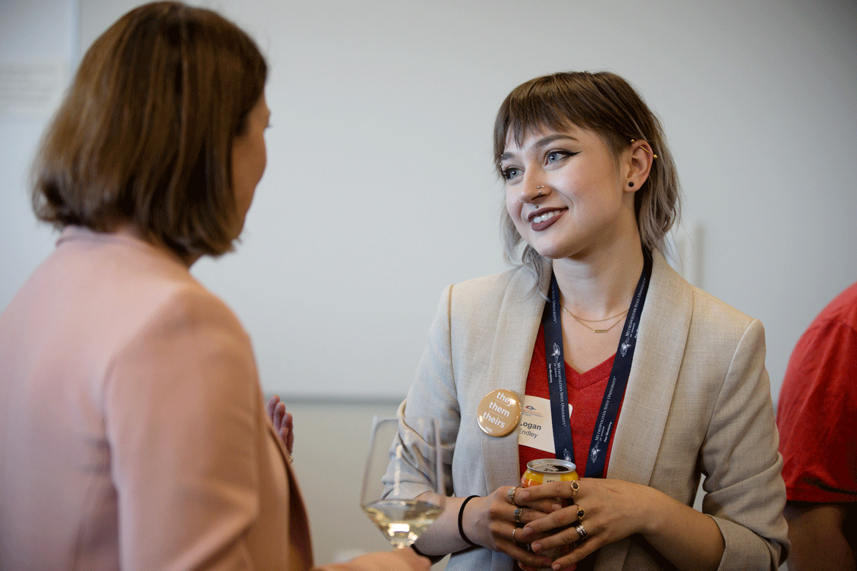 A female student talks with a female businesswoman