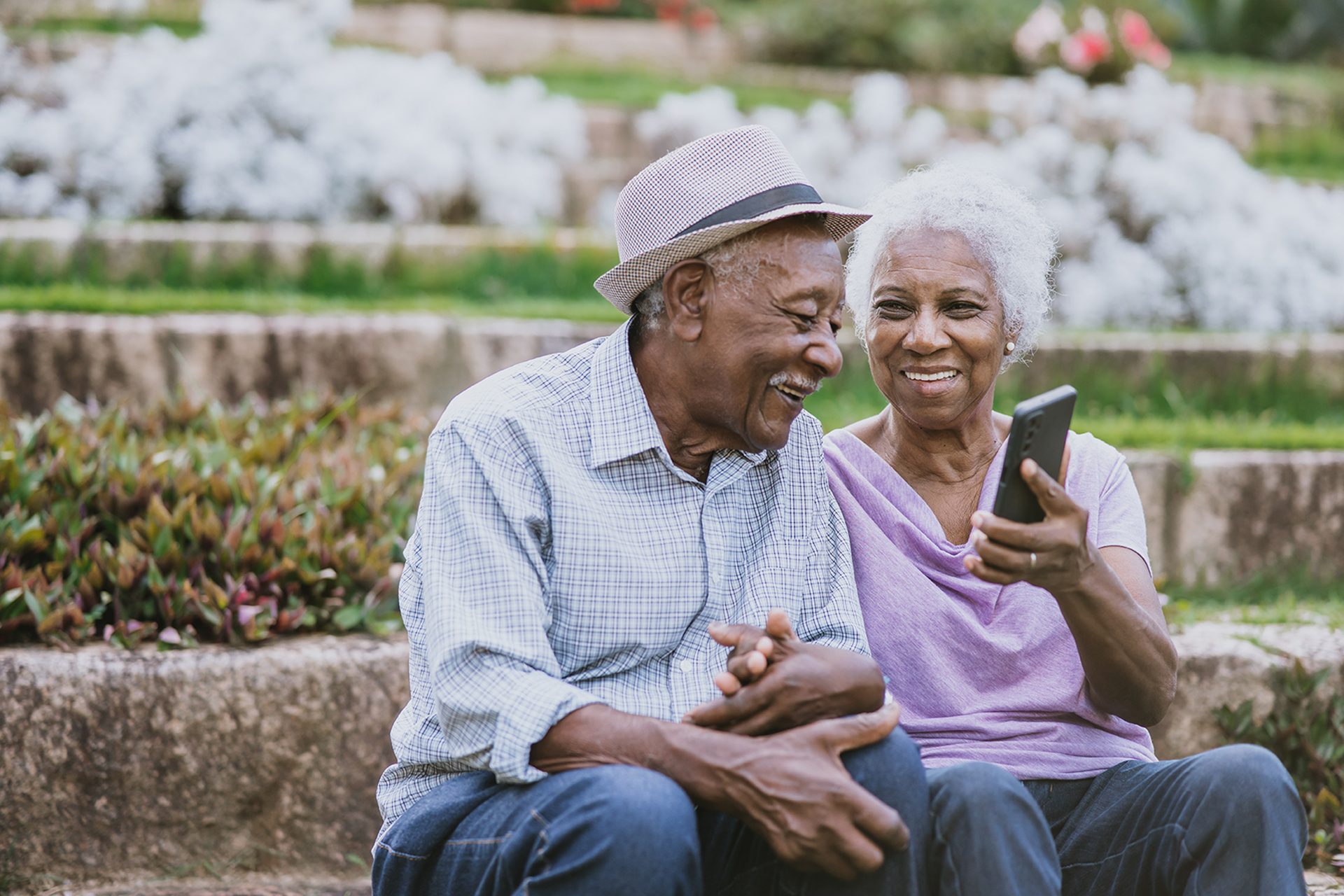 Older adults looking at cell phone