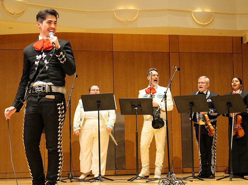 mariachi group performing on a stage
