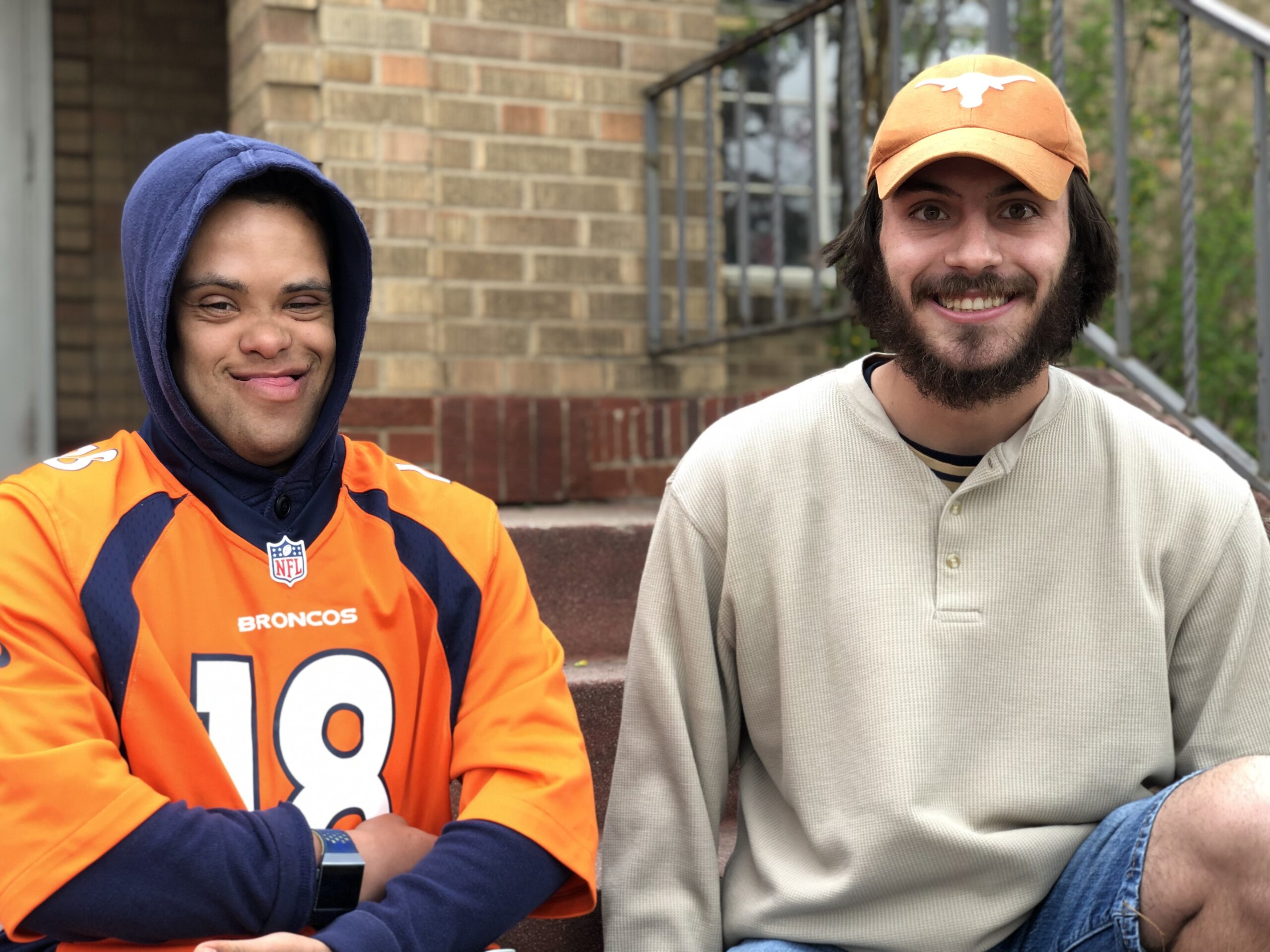 Decorative: Inclusive Higher Education students sit together on outdoor steps.