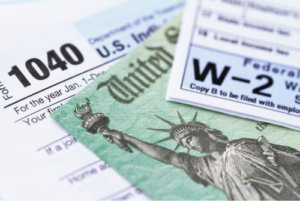 Graphic of tax documents stacked over each other.