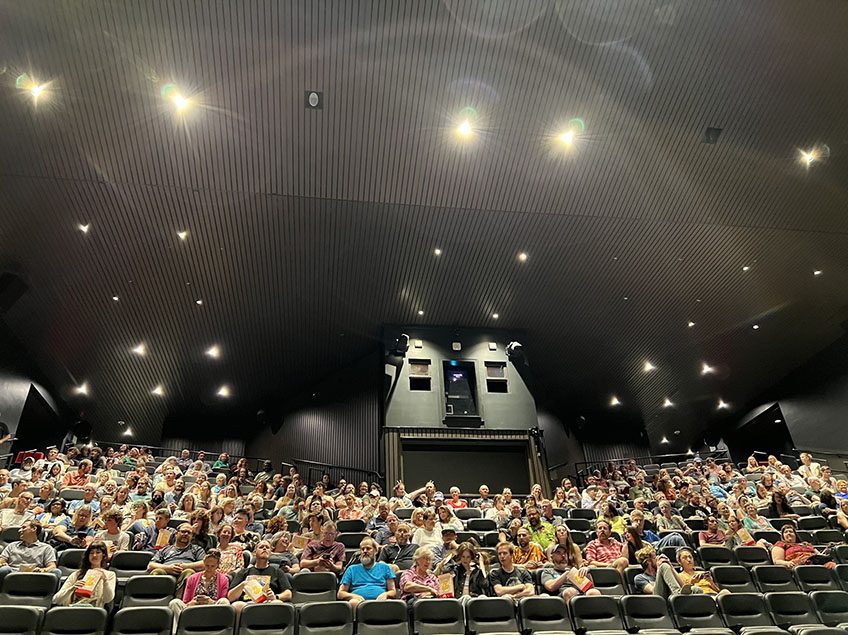 Image of the audience at the Denver Museum of Nature and Science for the 13th Annual Sci-Fi Film Series