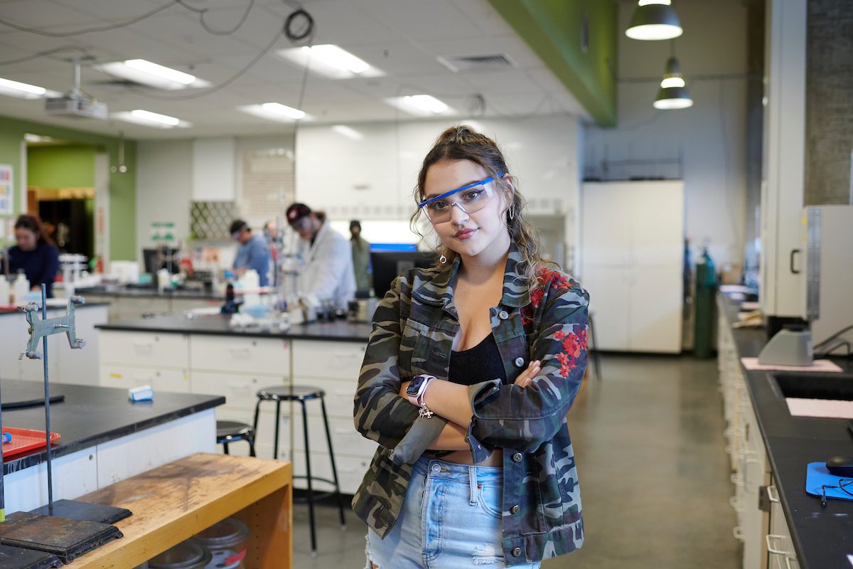 Student standing in a laboratory.