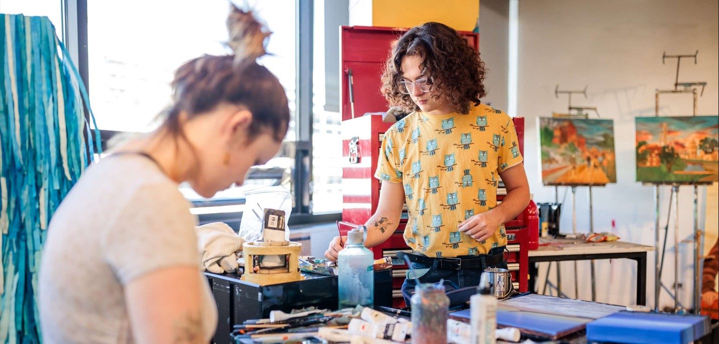 Two students painting