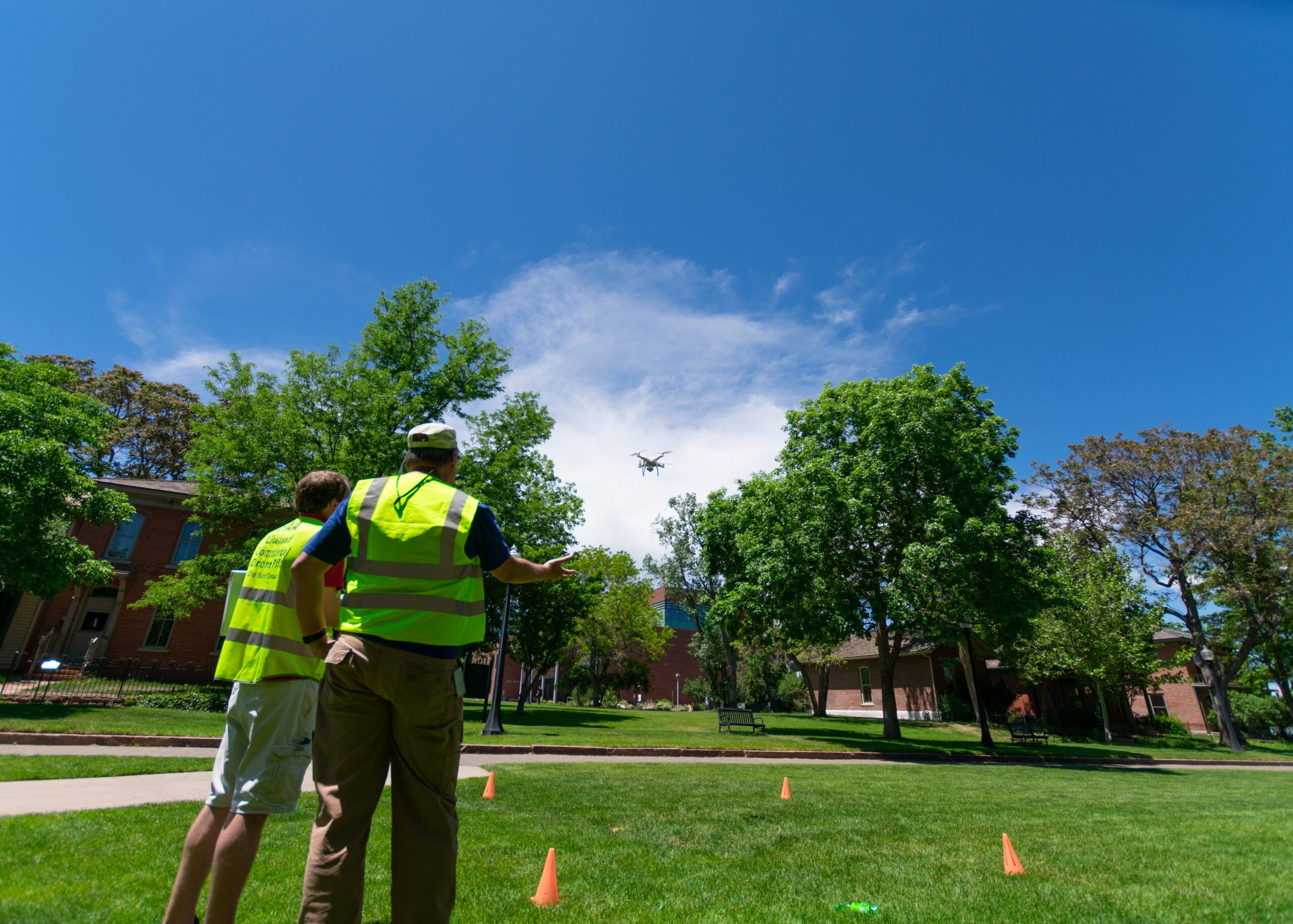 Josh Noel, program coordinator, and Alex Toussaint, aeronautics technician specialist, do aerial drone mapping of the 9th Street Park.