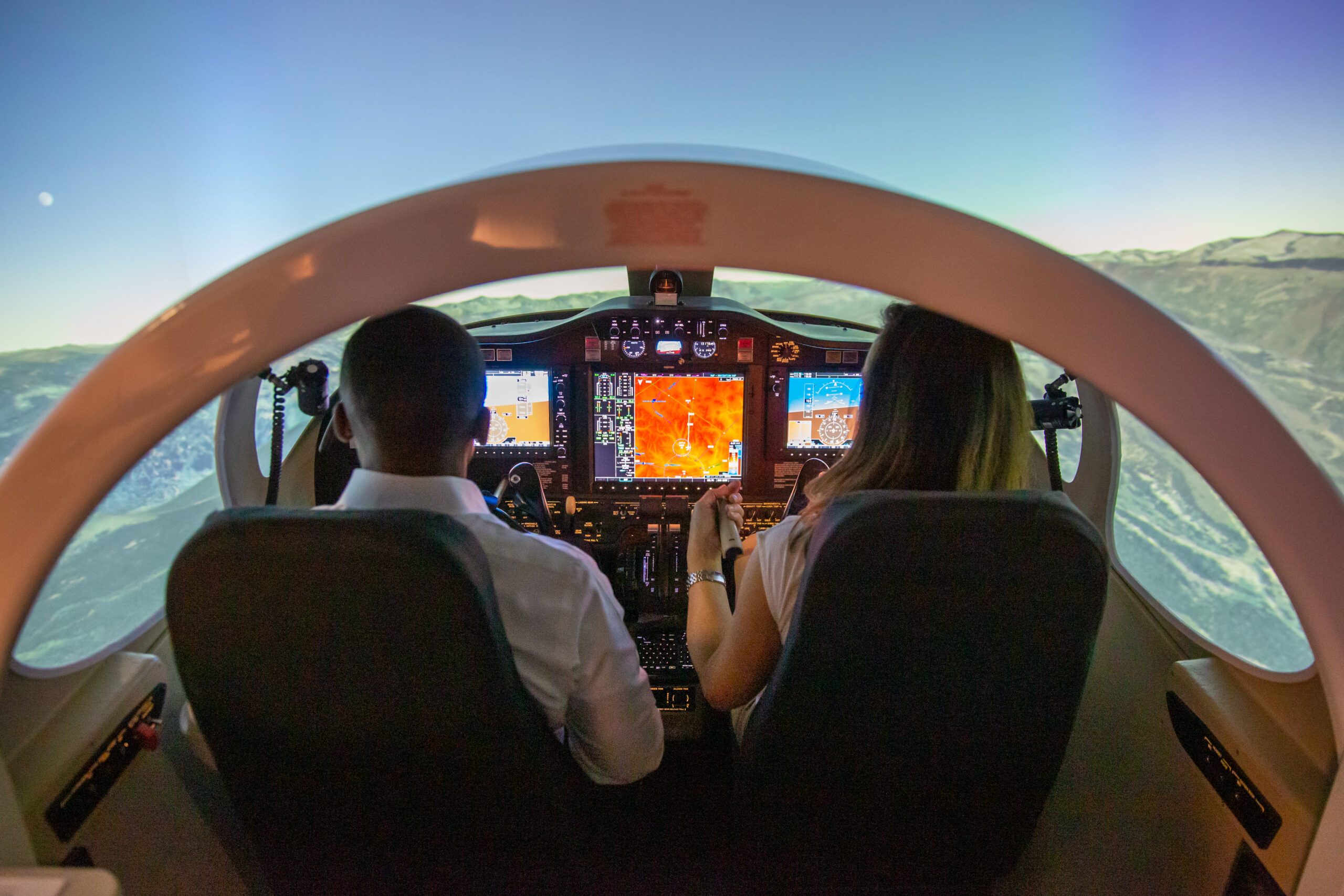 General McDew and Dr. Davidson visits Aerospace and Engineering Science Building. President Janine Davidson and General Darren McDew experience the flight simulator in the 7th Street Classroom building on Thursday, Oct. 27, 2022. President Janine Davidson, Ph.D., and General Darren McDew fly the simulator in the 7th Street Classroom.