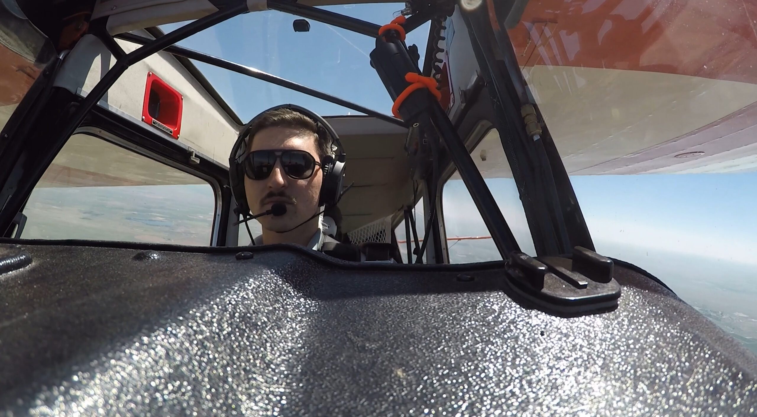MSU Denver student in the cockpit of an aerobatics plane.