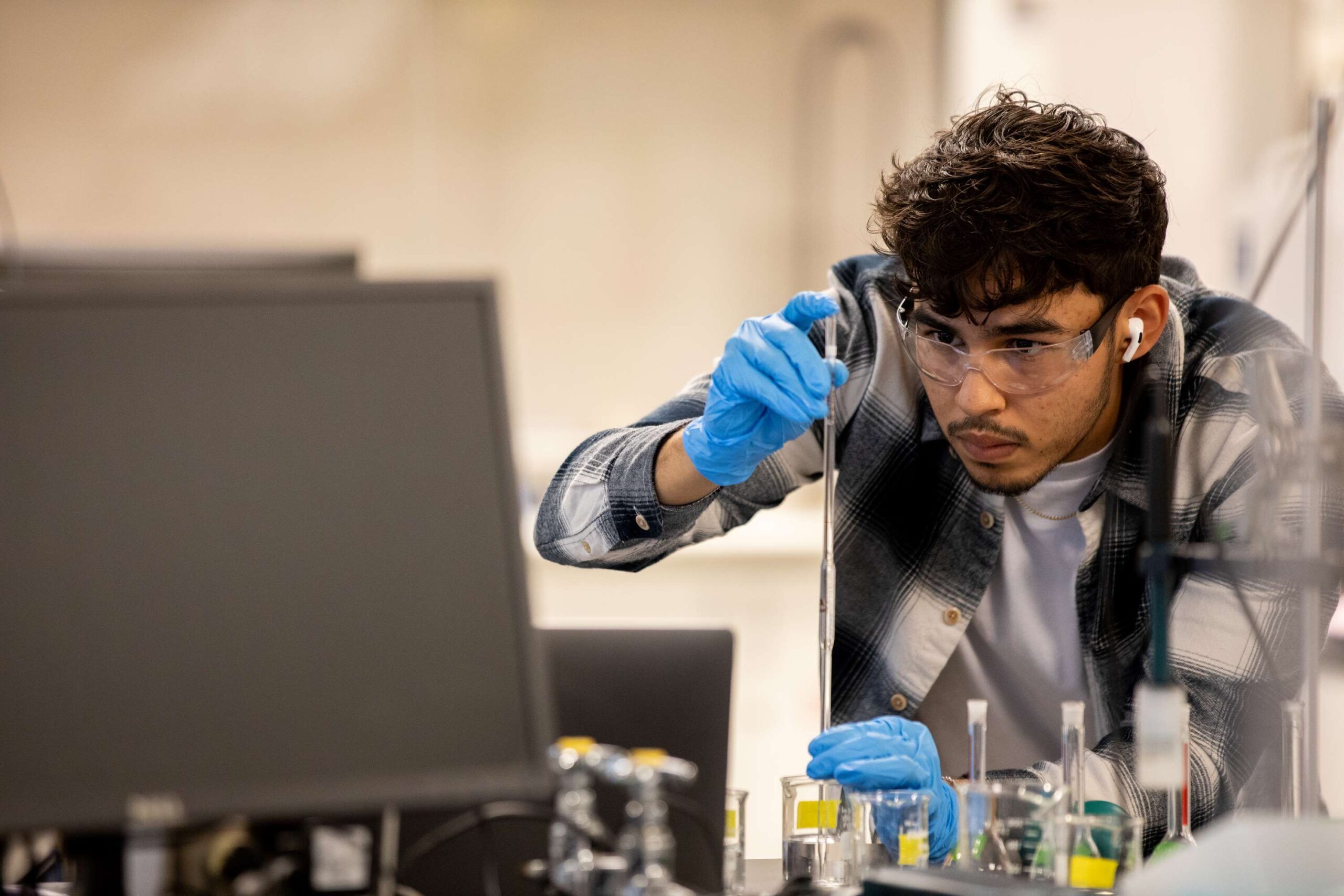 A student works in the Chemistry lab at MSU Denver