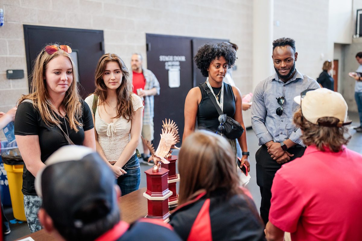 Students talk to different booths during the Aviation and Aerospace Science orientation on Aug. 18, 2023. Photo by Alyson McClaran