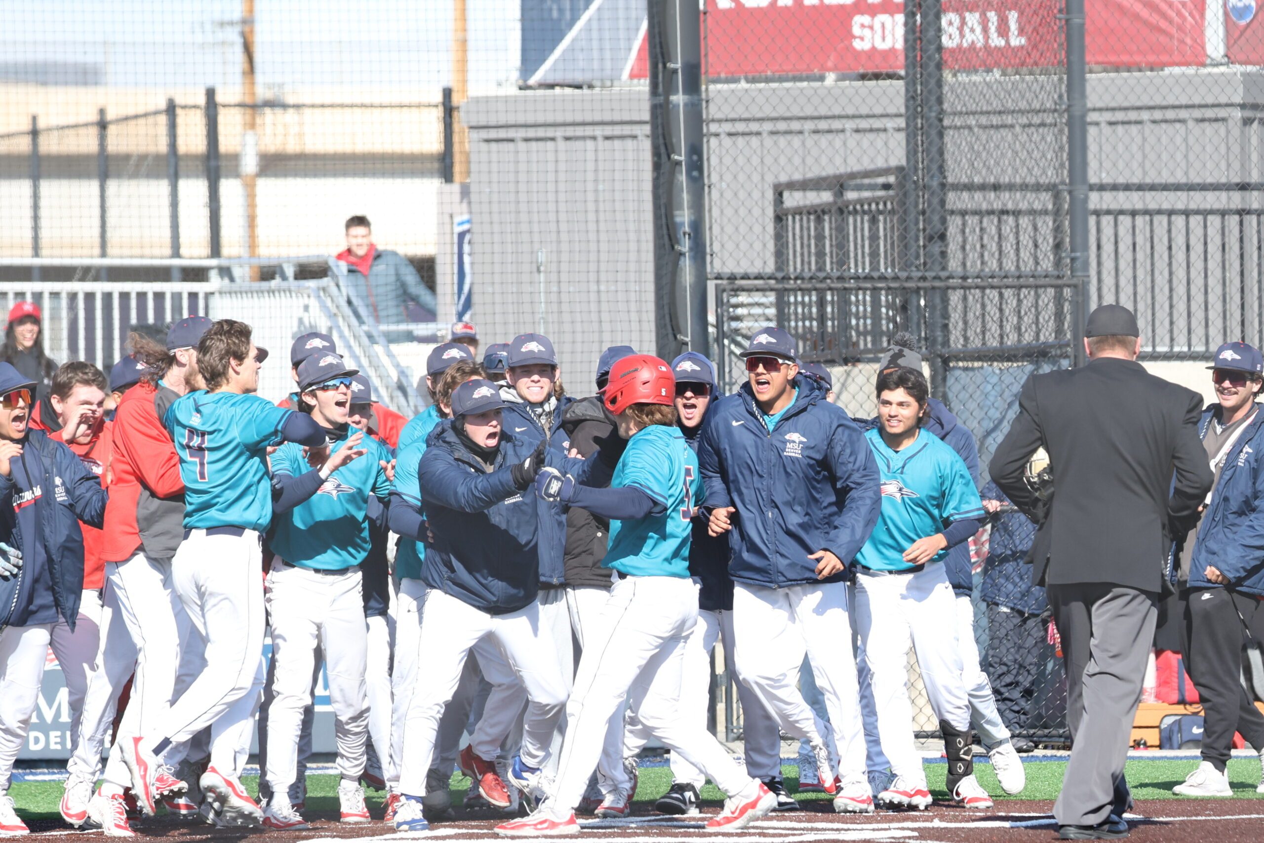 MSU Denver Baseball team celebrating a walk-off home run
