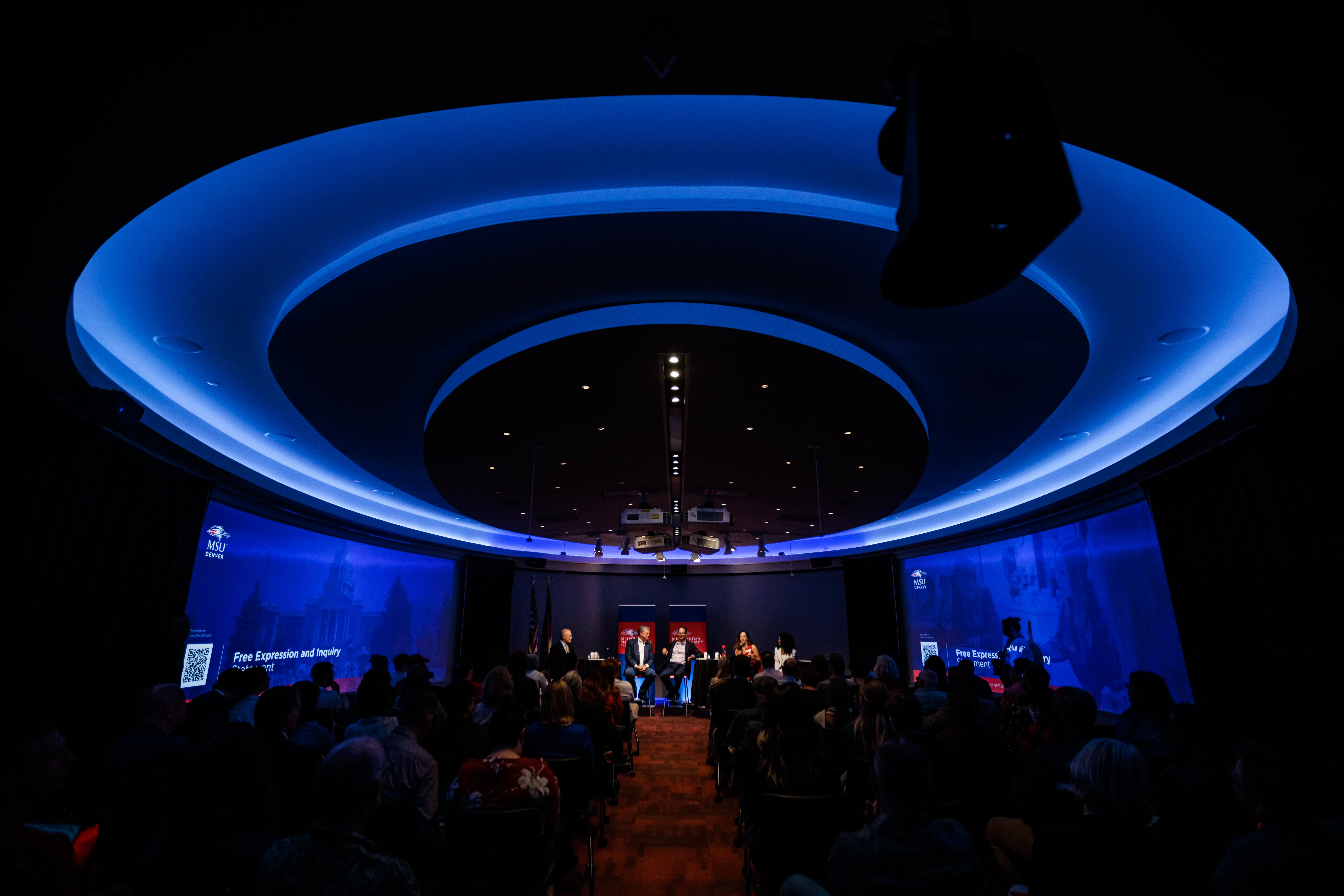 The darkened CAVEA Theater is highlighted by it's custom blue ceiling lighting.