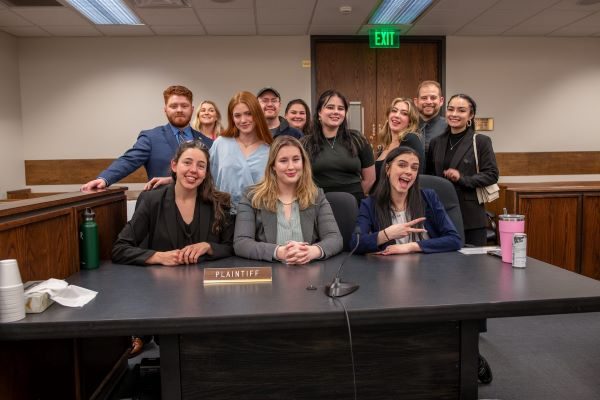 MSU Denver's AMTA Regionals team from 2024, standing behind a desk inside a courtroom