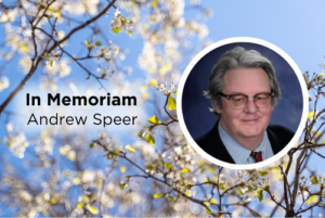 Andrew Speer in memorium graphic with blue sky and tree branches.