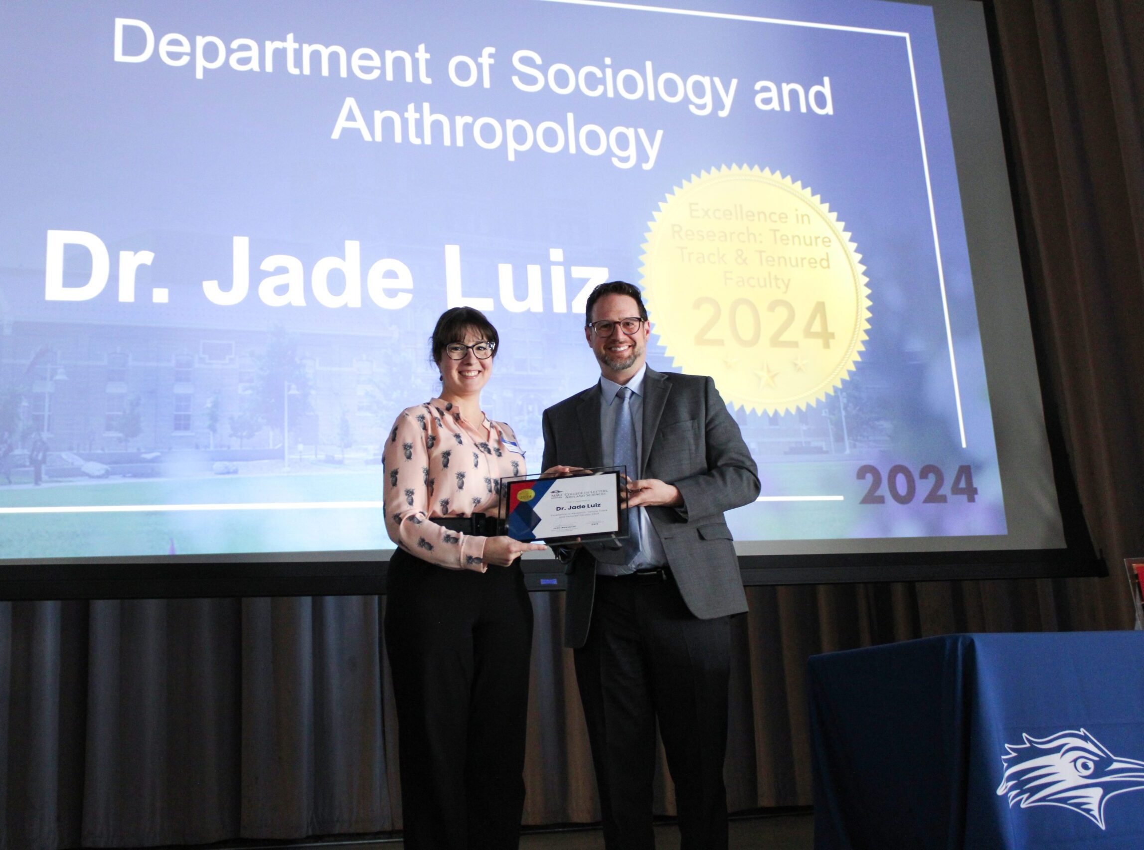 Dr. Jade Luiz receiving the 2024 CLAS Award for Excellence in Research