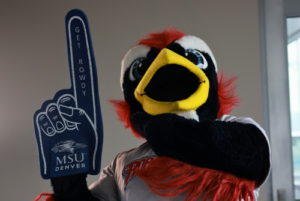 Rowdy the mascot with a pointer foam finger that says Get Rowdy