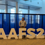 Nick Ewing standing behind a sign that says "AAFS2"
