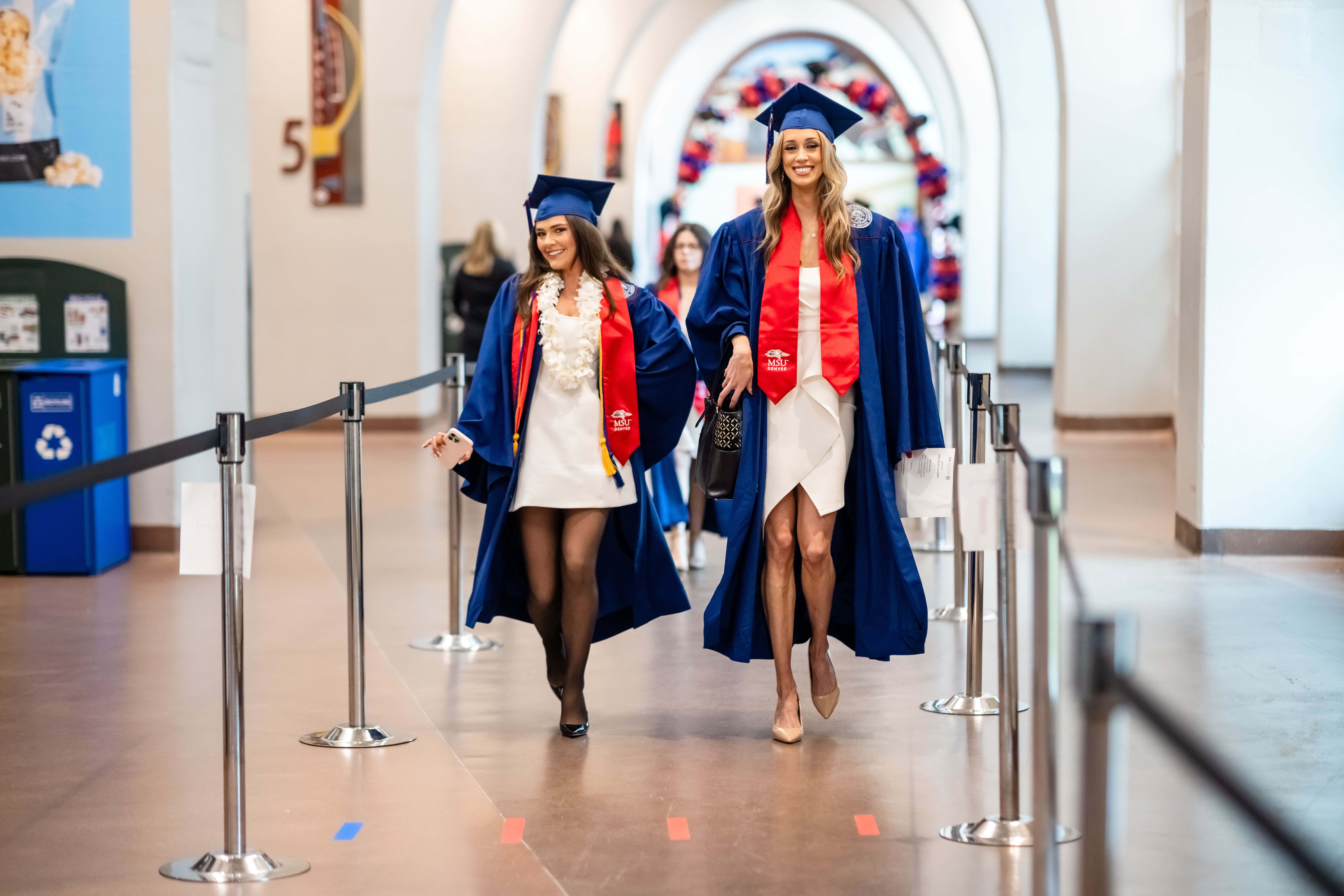 Two CACED students walking into the Morning Ceremony.