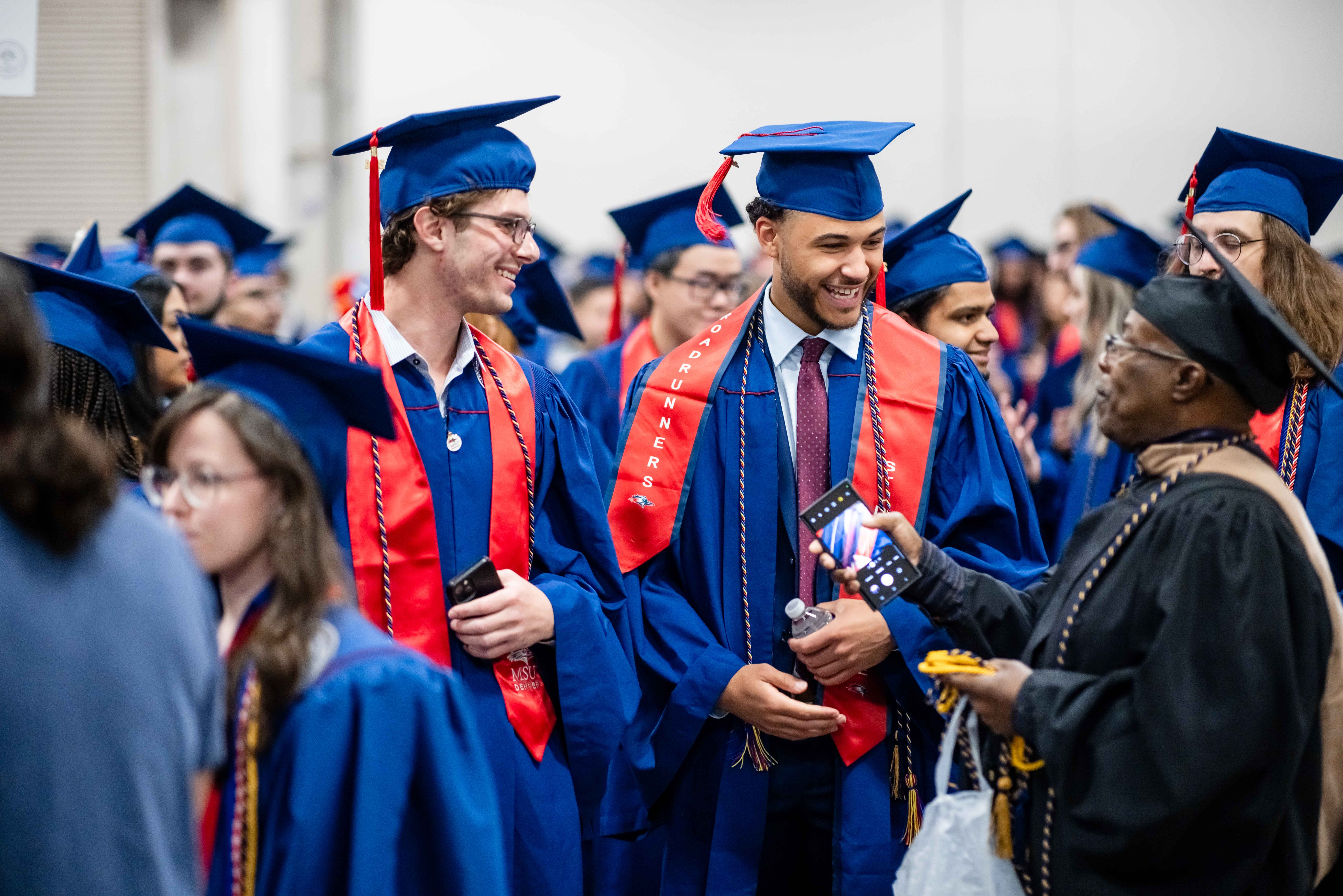 Picture of College of Business Students and staff at graduation.