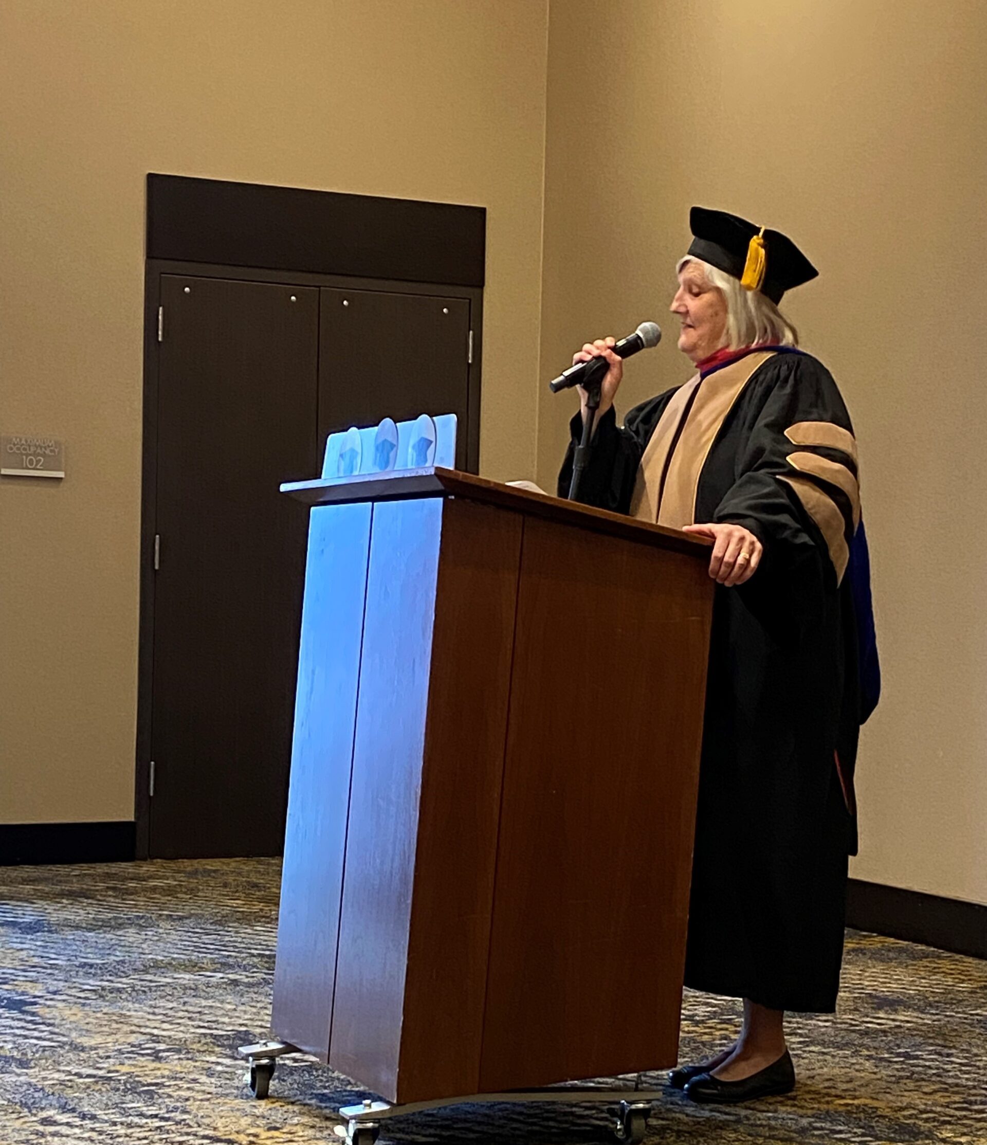 SP'24 MBA & MPAcc Hooding Celebration - Dean Ann Murphy speaking at the podium