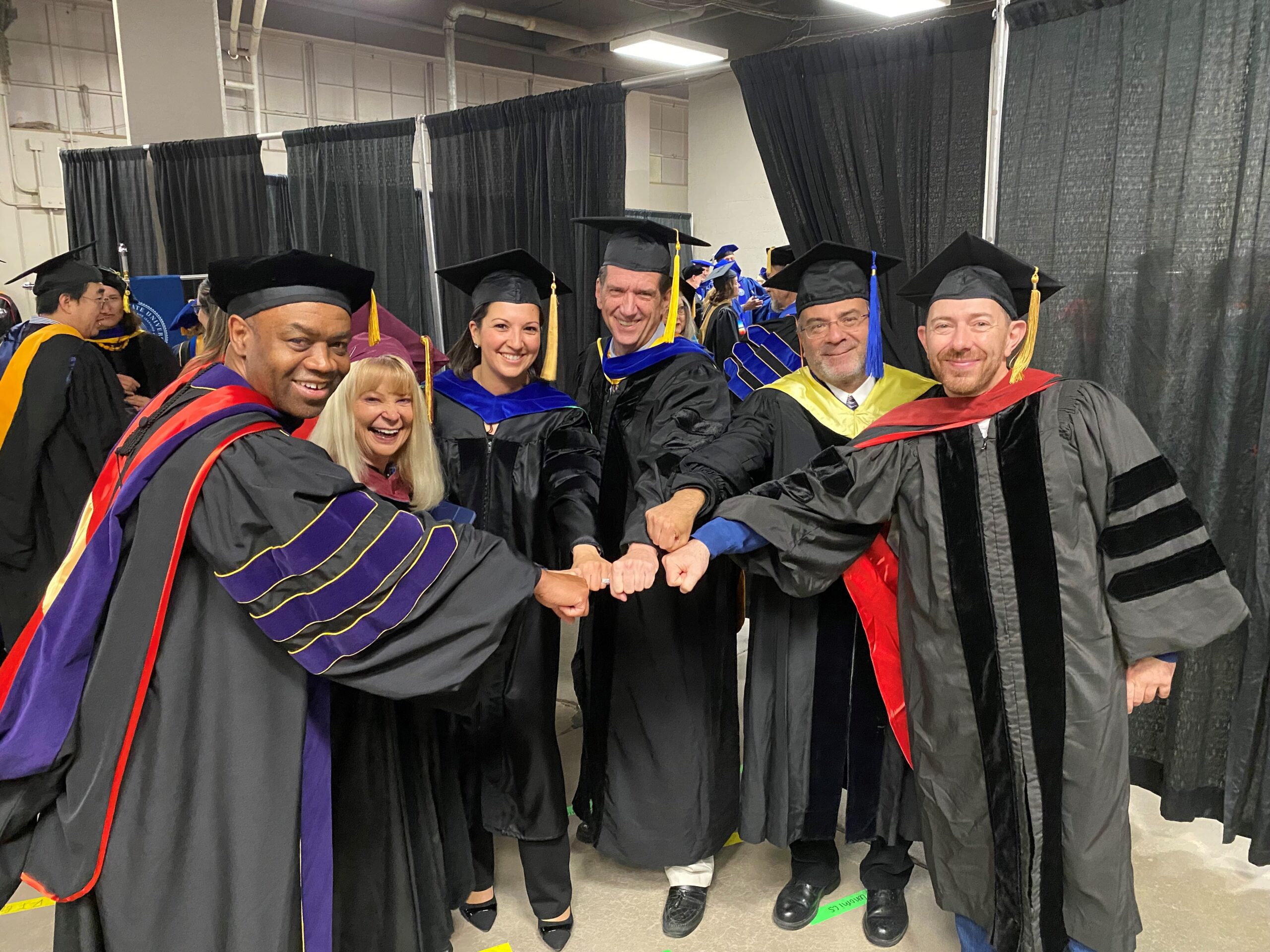 Spring 2024 Commencement - a group photo of the 6 College of Business Department Chairs in their regalia