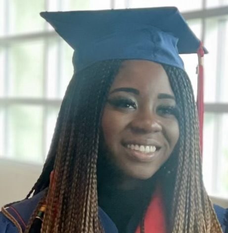 headshot of accounting alum & new mpacc student in graduation regalia- Dez Onyewuenyi