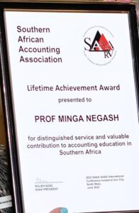 a photo of the plaque for Accounting faculty Minga Negash's award - Southern African Accounting Association's Lifetime Achievement Award (awarded June 2023, picked up in summer 2024)