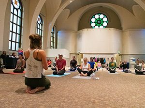MSU Denver staff and students do yoga in St. Cajetans.
