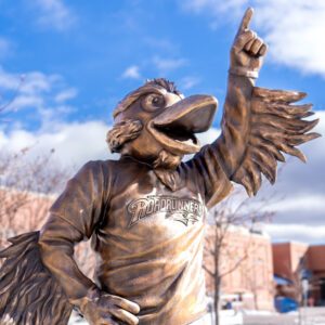 A close-up of the Rowdy the Roadrunner statue in front of the Tivoli on a sunny afternoon in January 2024