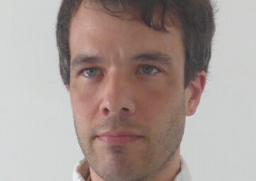 Image of man in white shirt.