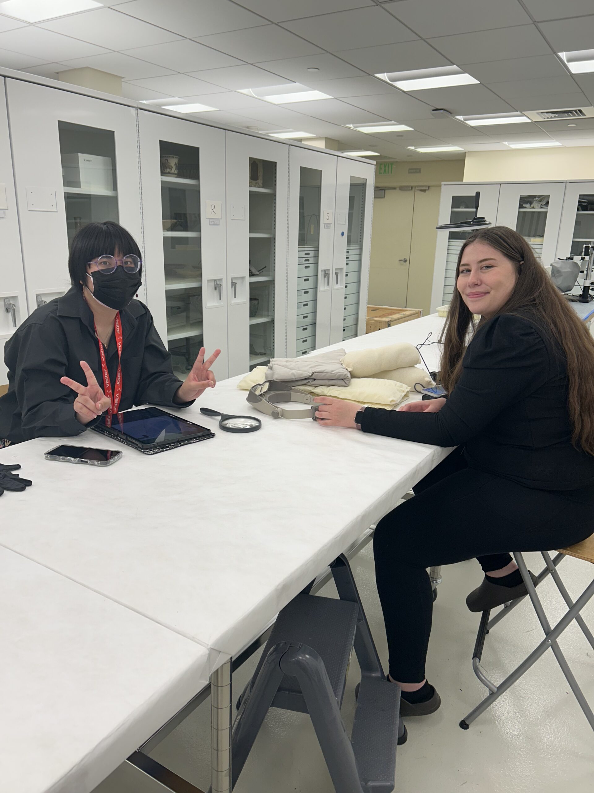 Two MSU Denver students sitting in an artifact room