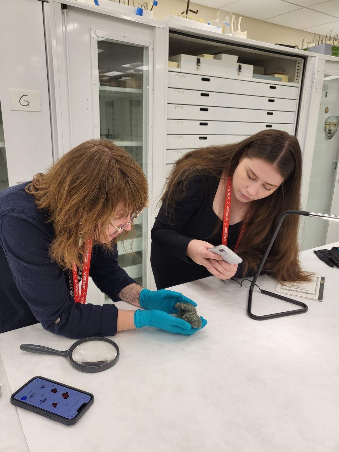 Two MSU Denver students examining an artifact