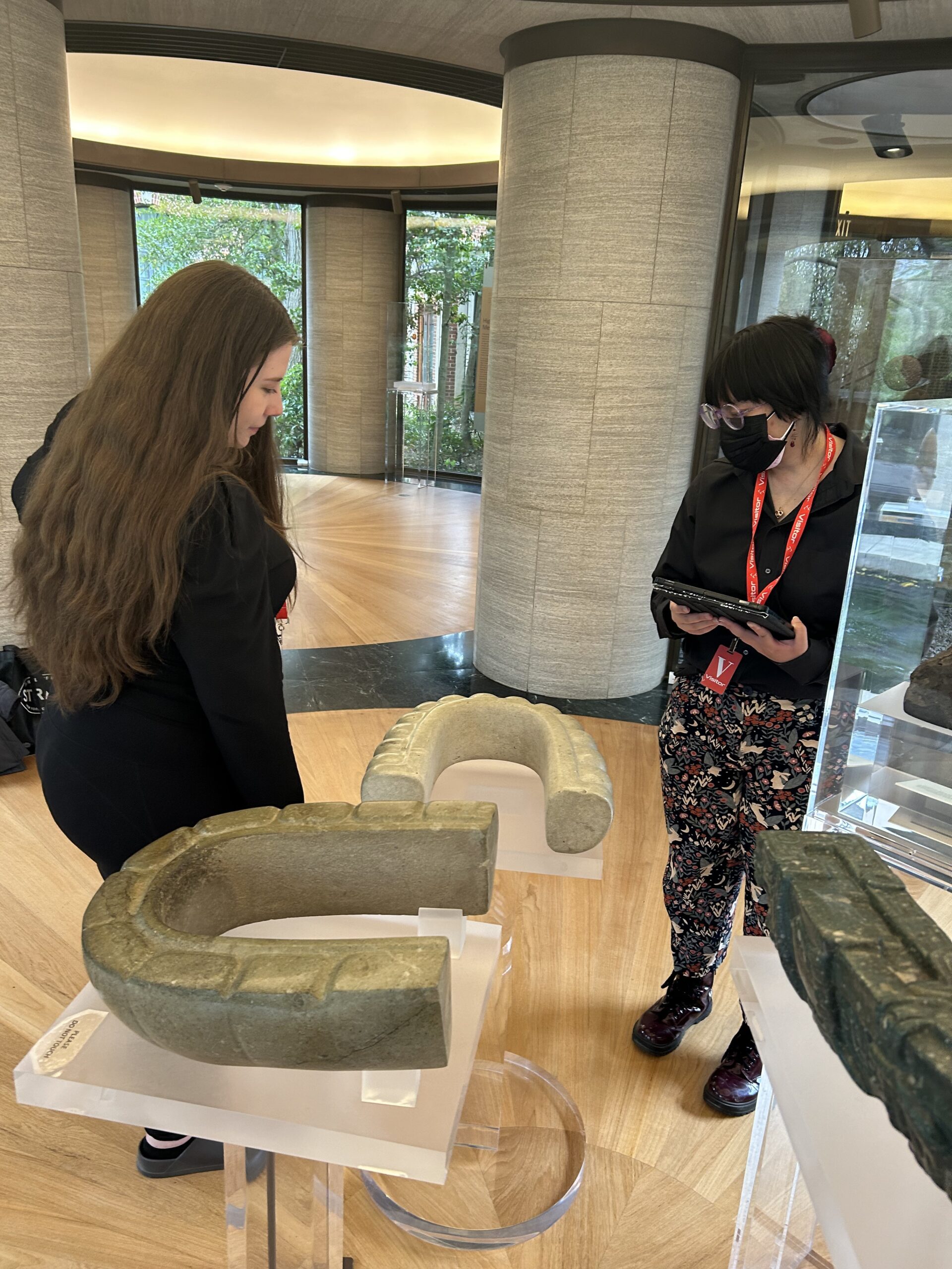 Two MSU Denver students looking at an old statue