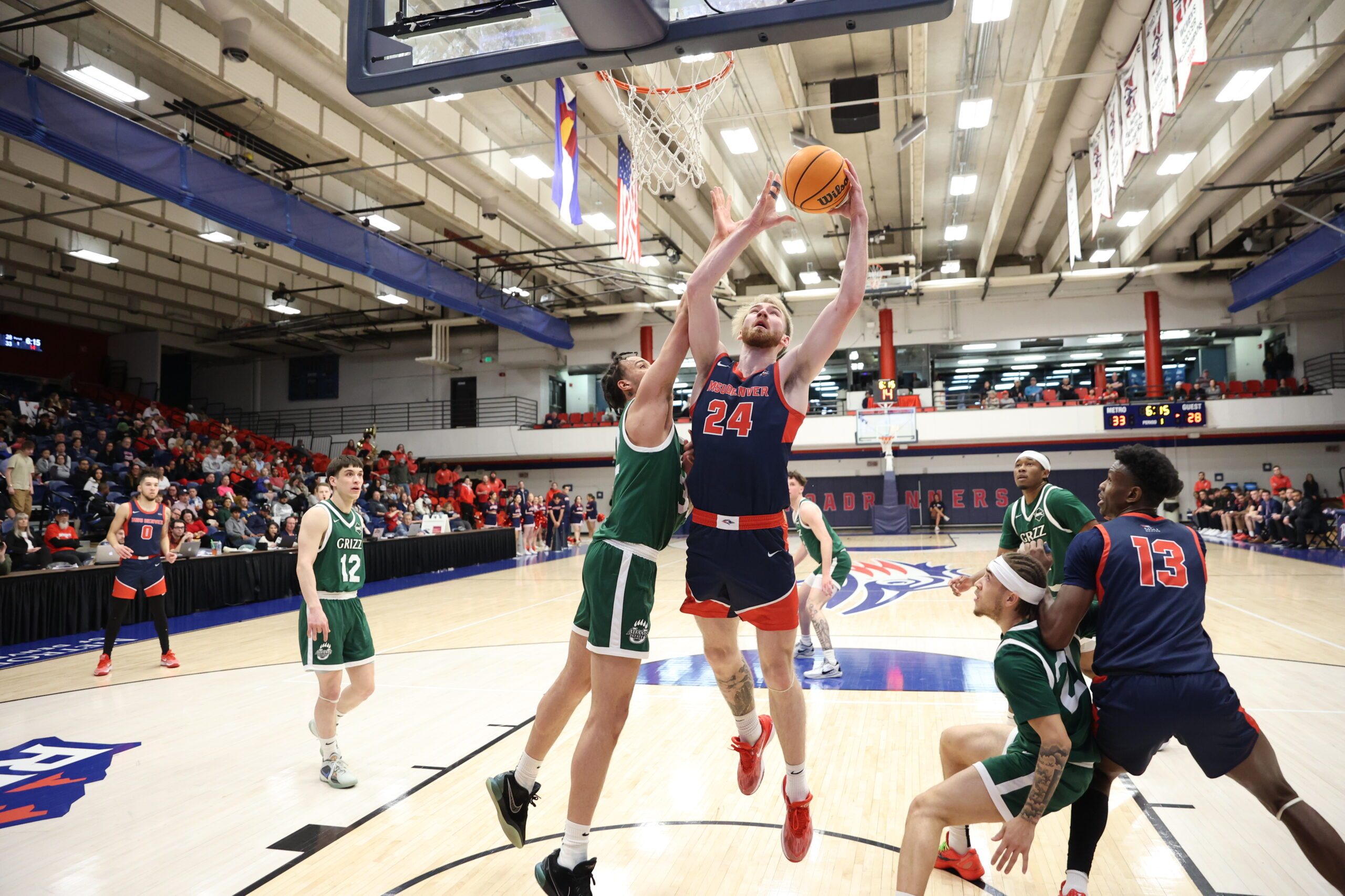 MSU Denver Men's Basketball Player Caleb McGill shooting a basketball